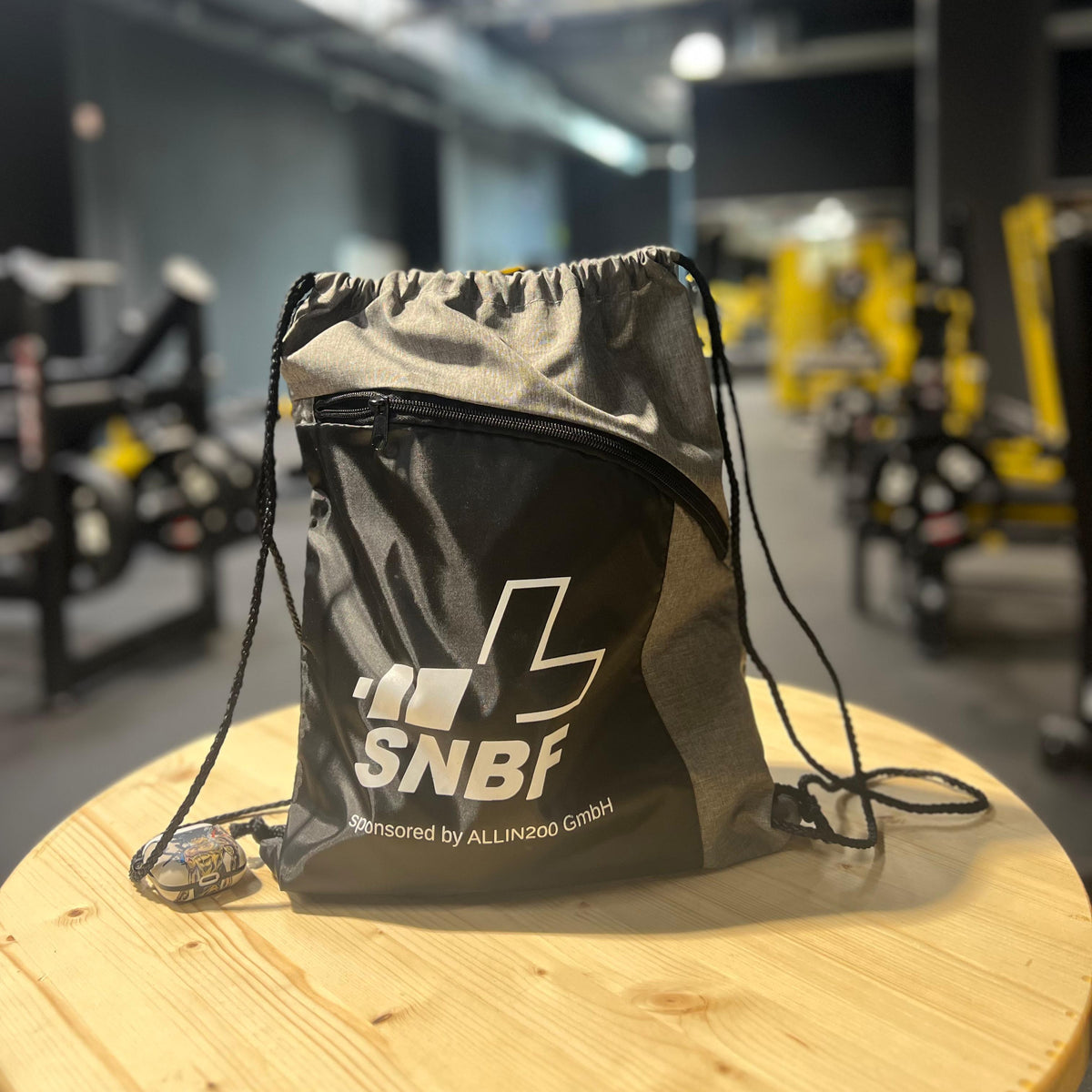 Black drawstring bag with 'SNBF' logo